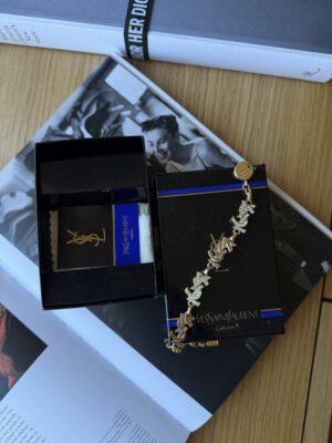 Bransoletka bikolor YSL Yves Saint Laurent wysadzana kryształkami
